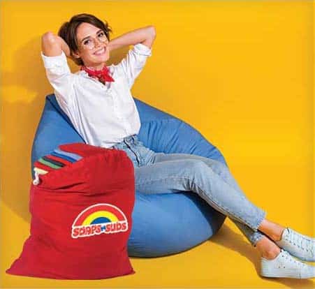 Woman relaxing with Soaps N Suds' Drop Off Laundry Services